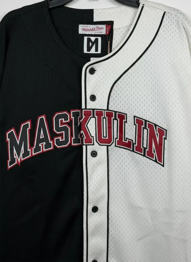 Split-Mesh-Black-White--sport-short Close-up of asymmetric mesh and fabric split on athletic t-shirt