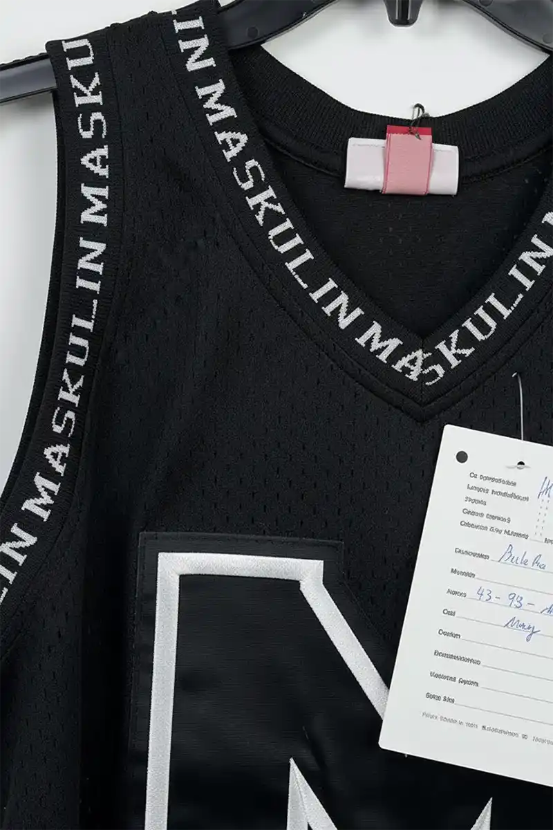 essential-tank-fabric-texture-close-up Close-up of soft cotton fabric texture showing breathable weave on essential tank top